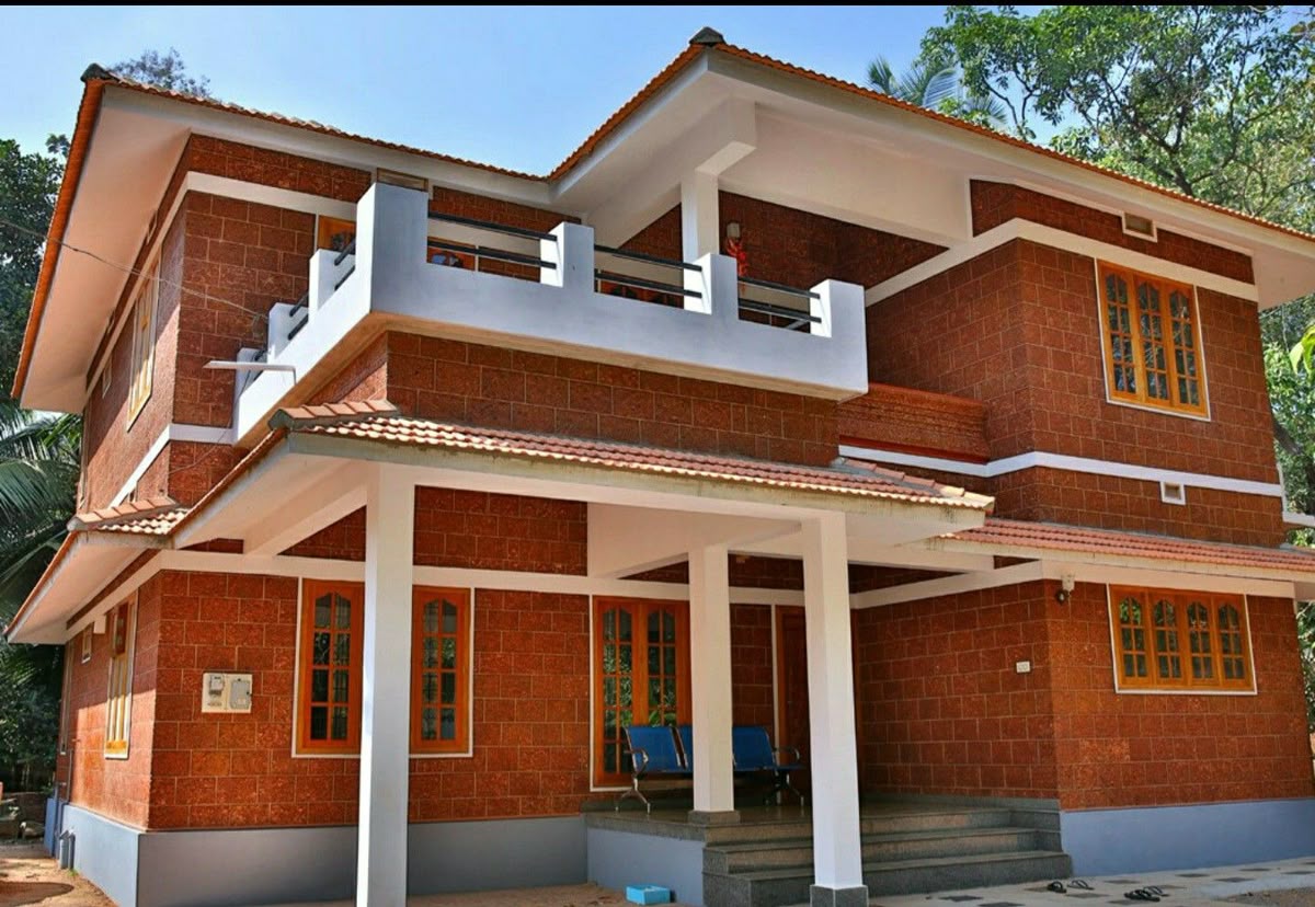 Modern Chennai villa exterior showcasing Porotherm clay brick wall construction